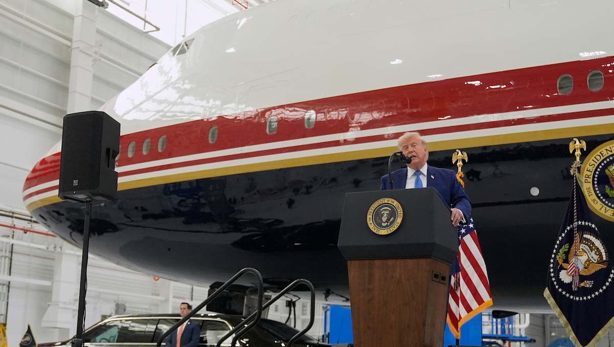 President Donald Trump unveils the new Air Force One, a converted Qatari jet