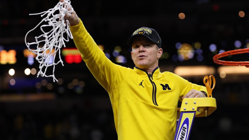INDIANAPOLIS, INDIANA – APRIL 06: Head coach Dusty May of the Michigan Wolverines cuts down the net after defeating the UConn Huskies 69-63 in the National Championship of the 2026 NCAA Men’s Basketball Tournament at Lucas Oil Stadium on April 06, 2026 in Indianapolis, Indiana. (Photo by Michael Reaves/Getty Images)