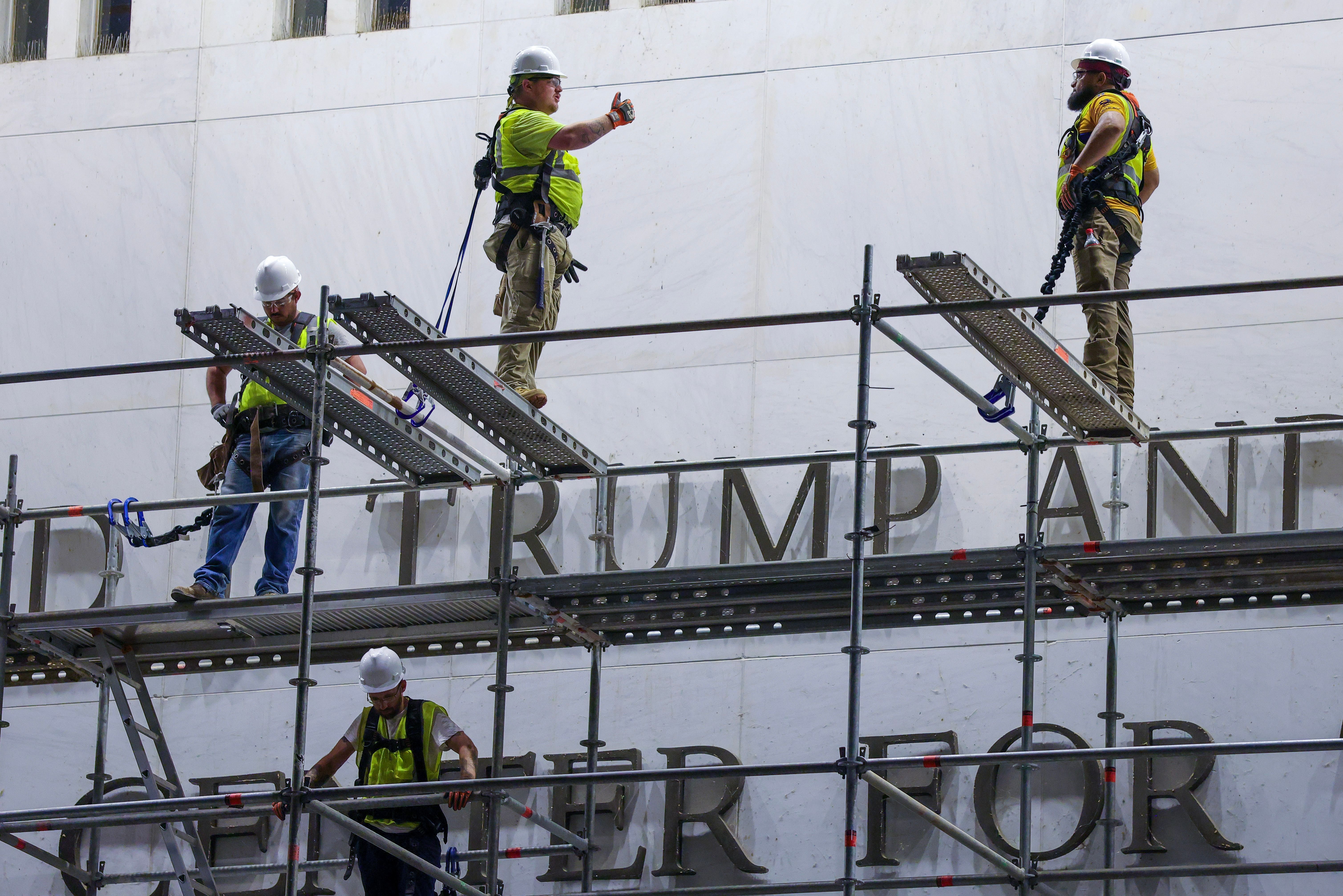 Workers begin removing Trump's name from the Kennedy Center, hours after a court-ordered deadline