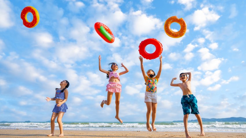 Playful children playing on the beach.