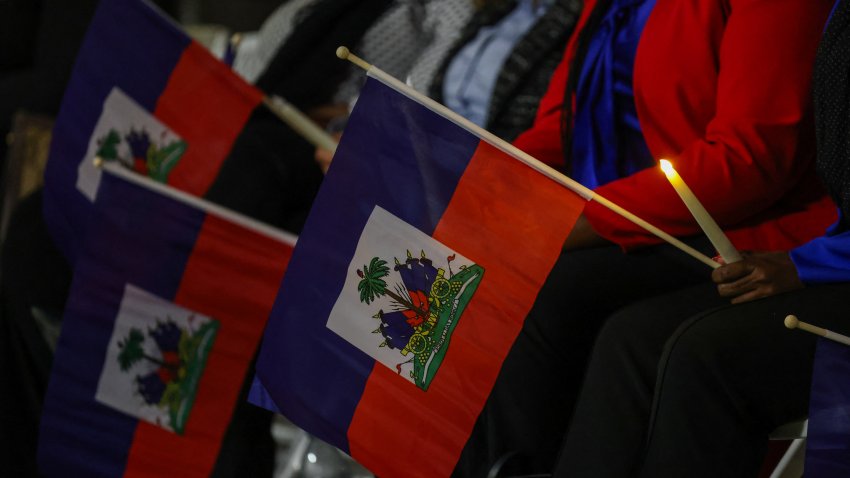 People attend a candlelight vigil for Haitians living in the US under the Temporary Protected Status (TPS) immigration program in Miami, Florida on February 3, 2026. Late on February 2, federal judge Ana C. Reyes of the Federal District Court in Washington, blocked the Trump administration from ending TPS for an estimated 350,000 Haitian immigrants. The status, which offers protection from deportation and work authorization, was set to expire on Feb. 3. (Photo by Giorgio Viera / AFP via Getty Images)