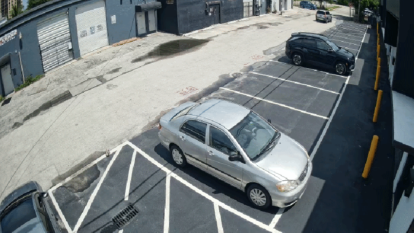 Surveillance video shows the moment a truck crashed into multiple vehicles and brewery in North Miami, in an incident that left the driver facing charges.