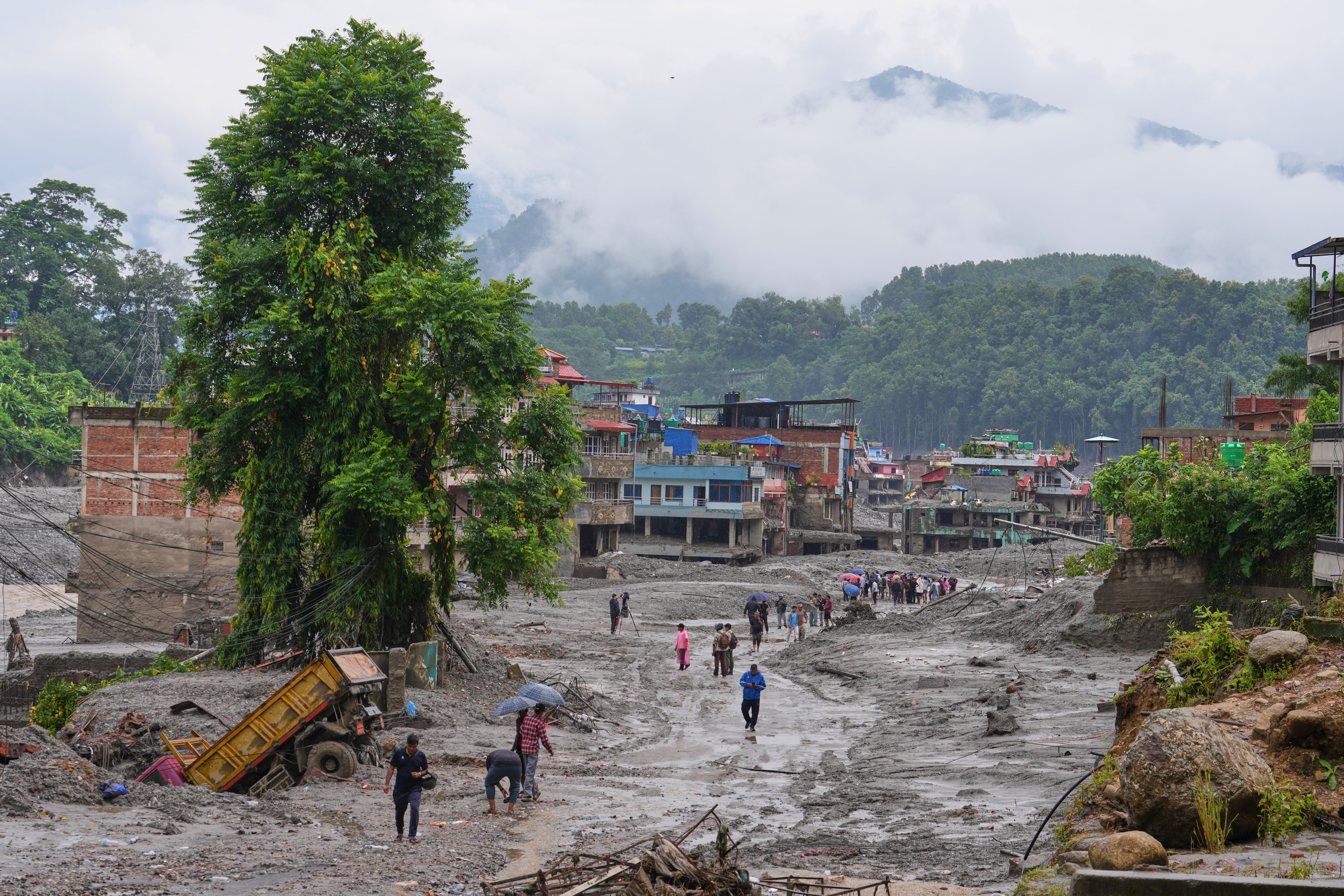 Nepal-China flood survivors reach safe areas as families await news of nearly 3,000 missing