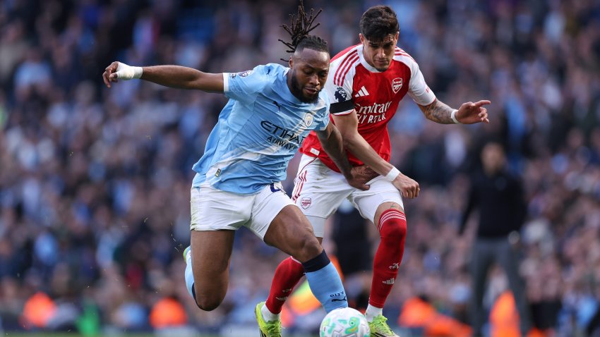 Antoine Semenyo of Manchester City battles Piero Hincapie of Arsenal.
