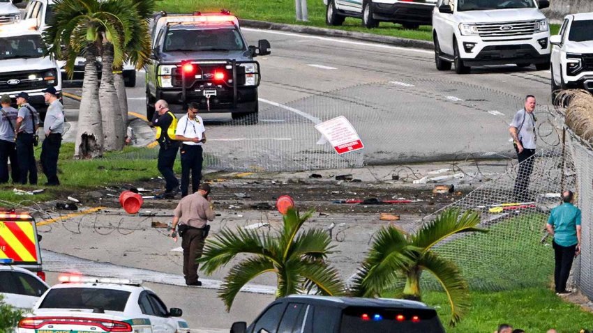 Officials investigate the scene where a Prime Air cargo plane overran the runway and crashed into other vehicles at Miami International Airport at Miami International Airport in Miami, Florida, on September 6, 2026. An Amazon cargo plane overshot a runway as it landed in Miami, crashing into vehicles and catching fire, officials said. There was no immediate word on casualties in the incident reported by the Federal Aviation Administration (FAA) and Miami International Airport. Video showed smoke billowing from a Boeing 767 operating for Amazon Prime Air. (Photo by CHANDAN KHANNA / AFP via Getty Images)