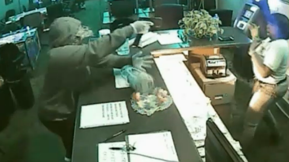 Video: Masked Suspect Points Gun at Clerk During Robbery